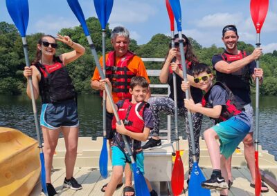 Family and friends after a kayaking adventure in South Wales